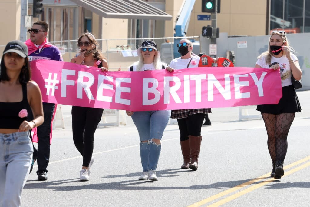 #FreeBritney activists protest during a rally held in conjunction with a hearing on the future of Britney Spears’ conservatorship at the Stanley Mosk Courthouse on September 29, 2021 in Los Angeles, California. Spears was placed in a conservatorship managed by her father, Jamie Spears, and an attorney, which controls her assets and business dealings, following her involuntary hospitalization for mental care in 2008. Spears and her father have asked the court to remove him from his role in the conservatorship. (Photo by Kevin Winter/Getty Images)