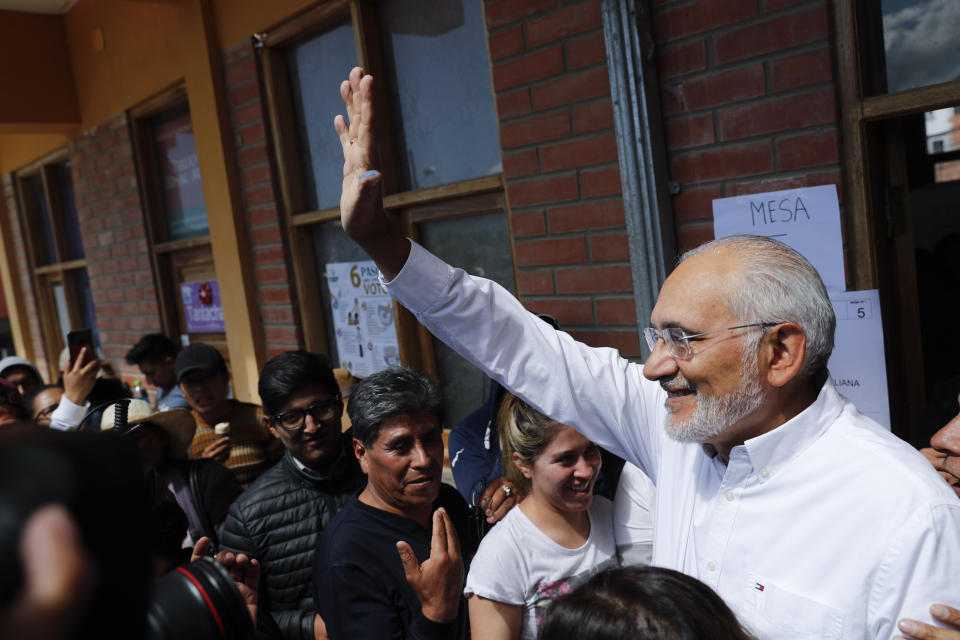 Opposition presidential candidate Carlos Mesa waves after voting during general elections in Mallasilla, in the outskirts of La Paz, Bolivia, Sunday, Oct. 20, 2019. Former president Mesa is the closest rival to President Evo Morales, who is seeking a fourth term in the country's general elections. (AP Photo/Jorge Saenz)