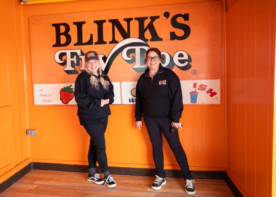 Hyatt Hodges and her sister Caroline Tighe show off one of the original Blink's Fry Doe signs at the 151 Ocean Blvd location. Blink's Fry Doe is celebrating its 50th year of operation at Hampton Beach in 2024.