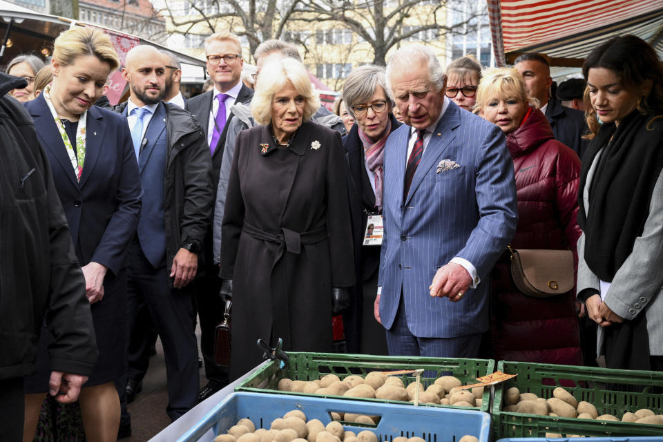 FILE - Berlin's Mayor Franziska Giffey, Britain's King Charles and Camilla the Queen Consort visit a farmer's market on Wittenbergplatz square, in Berlin, Germany, Thursday, March 30, 2023. King Charles III won plenty of hearts during his three-day visit to Germany, his first foreign trip since becoming king following the death of his mother, Elizabeth II, last year. (Annegret Hilse//Pool Photo via AP, File)