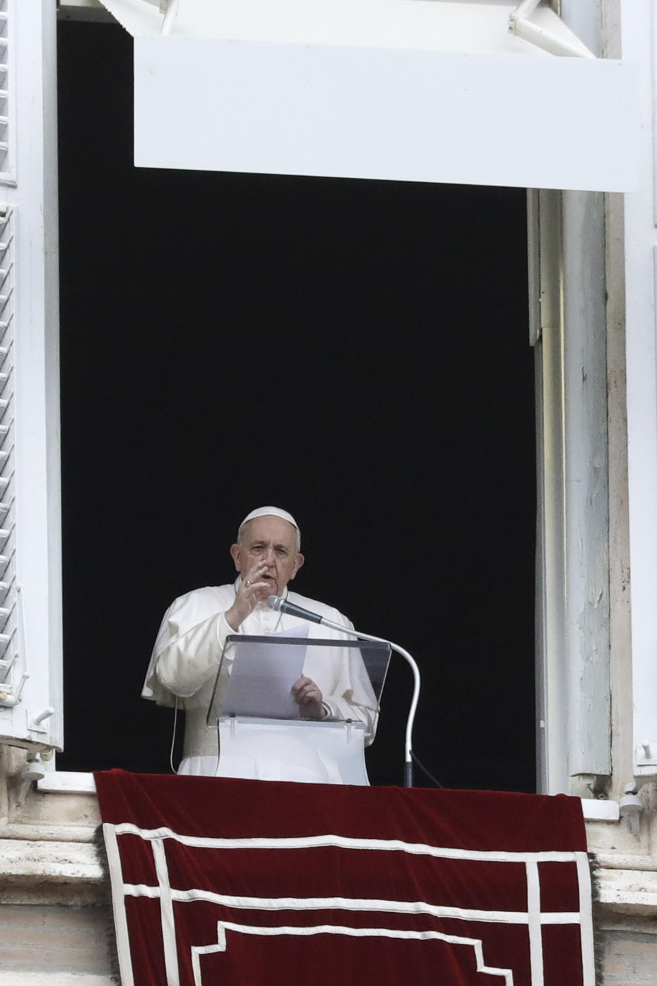 Pope Francis delivers his message during the Angelus noon prayer from the window of his studio overlooking St.Peter's Square, on the Immaculate Conception day, at the Vatican, Tuesday, Dec. 8, 2020. (AP Photo/Andrew Medichini)