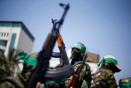 Palestinian Hamas militants take part in a protest against Israel's new security measures at the entrance to the al-Aqsa mosque compound, in Gaza City July 21, 2017. REUTERS/Mohammed Salem