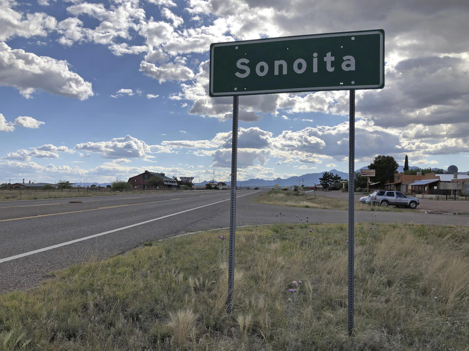 FILE - In this May 13, 2019, file photo, a sign for Sonoita stands in the heart of southeastern Arizona where owners of wineries and other small tourism operations worry that the Rosemont Copper Mine proposed to be built in the nearby Santa Rita Mountains could harm their businesses with mining trucks rumbling down scenic state highway 83 that runs past the range. A federal judge on Wednesday, July 31, 2019, has overturned the U.S. Forest Service's approval of a Canadian company's planned new copper mine in southeastern Arizona. The judge ruled the agency improperly evaluated and considered water use issues associated with the Rosemont Mine planned in the Santa Rita Mountains on part of the Coronado National Forest. (AP Photo/Anita Snow, File)