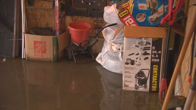 Homeowner says 9 days for city to respond to flooded back lane unacceptable