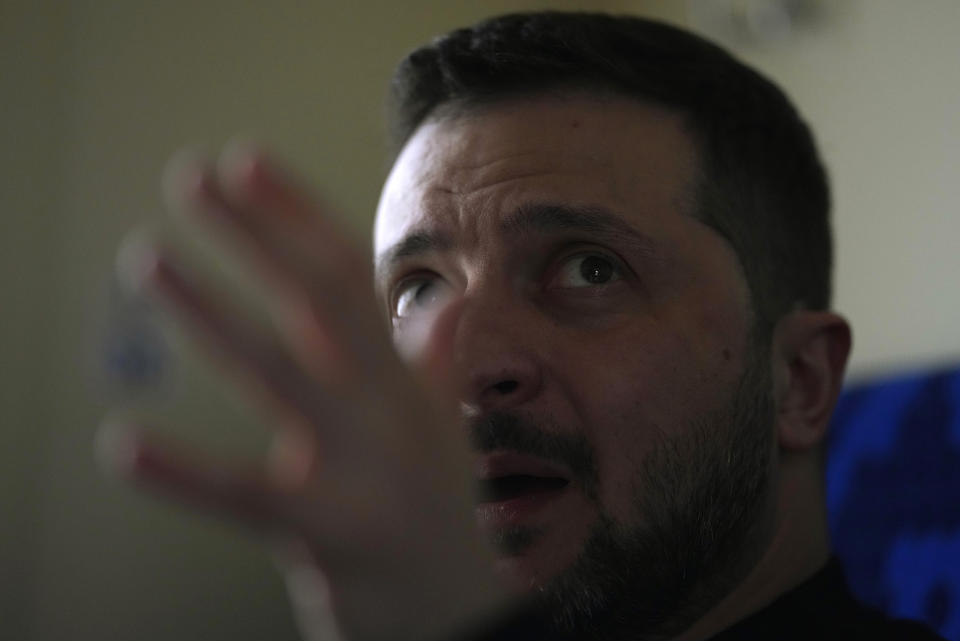 Ukrainian President Volodymyr Zelenskyy gestures as he speaks during an interview with Julie Pace, senior vice president and executive editor of The Associated Press, on a train traveling from the Sumy region to Kyiv, Ukraine, Tuesday March 28, 2023. (AP Photo/Efrem Lukatsky)