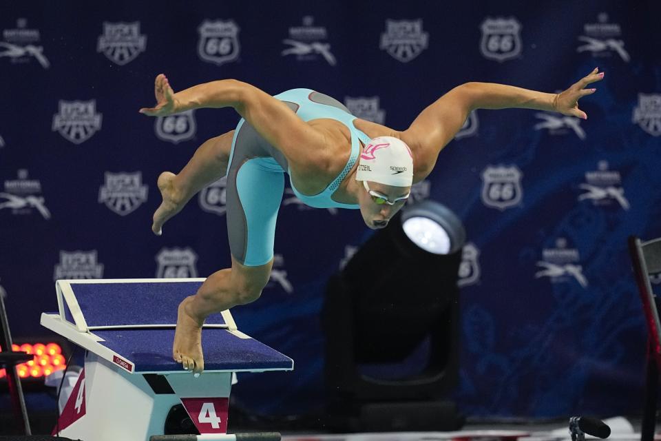 Abbey Weitzeil starts on her way to winning the 50-meter freestyle at the U.S. national championships swimming meet, Saturday, July 1, 2023, in Indianapolis. (AP Photo/Darron Cummings)