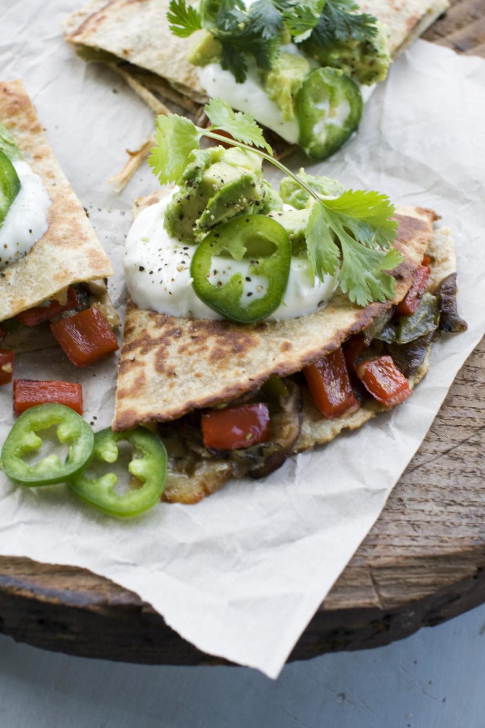 In this April 29, 2013 photo, mushroom, pepper and onion quesadillas are shown in Concord, N.H. Full-fat cheese is the secret to a flavorful recipe. (AP Photo/Matthew Mead)