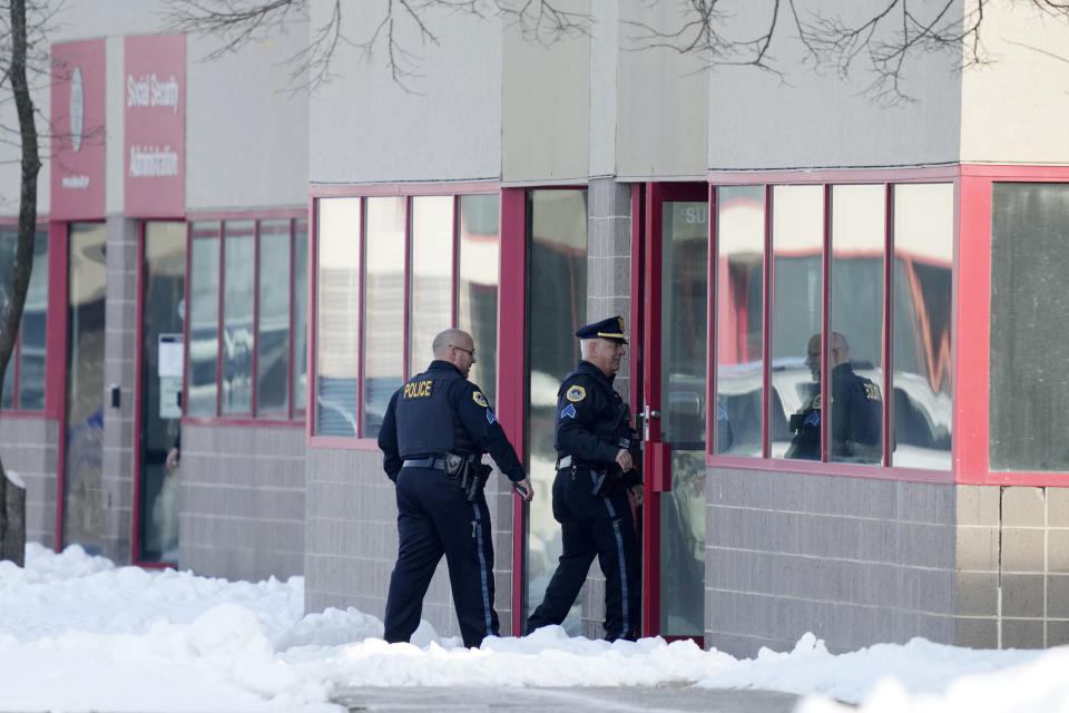 Law enforcement officers enter the Starts Right Here building, Monday, Jan. 23, 2023, in Des Moines, Iowa. Police say two students were killed and a teacher was injured in a shooting at the Des Moines school on the edge of the city's downtown. (AP Photo/Charlie Neibergall)