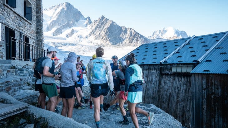 <span class="article__caption">A morning huddle from Courtney Dauwalter's Run the Alps hut trip in 2022 to Albert Premier hut on the side of the Le Tour glacier above Chamonix, France. </span> (Photo: Kim Strom)