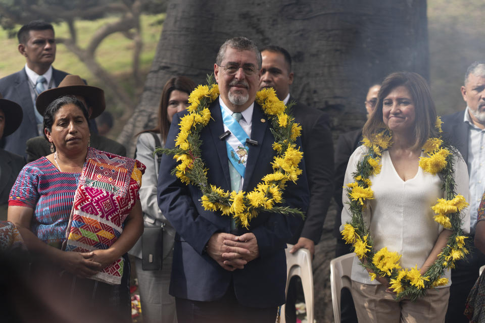 Guatemalan President Bernardo Arévalo, center, and his Vice President Karin Herrera, right, attend an Indigenous ceremony held in their honor at the sacred Mayan site of Kaminaljuyu in Guatemala City, Tuesday, Jan. 16, 2024. Arévalo and Herrera were inaugurated on Monday. (AP Photo/Moises Castillo)