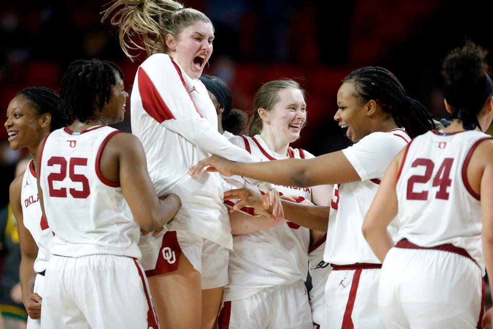 Oklahoma players celebrate their win over No. 14-ranked Baylor on Wednesday night at Lloyd Noble Center in Norman. The No. 23 Sooners beat the Bears 83-77.
