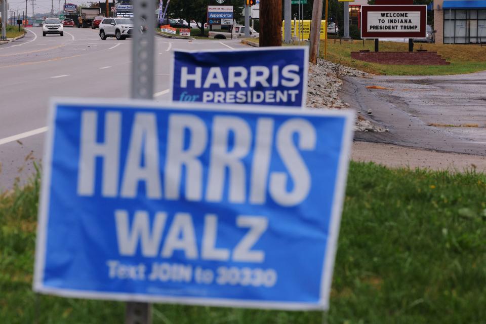 A sign supporting Democratic presidential nominee and U.S. Vice President Kamala Harris stands in front of a sign welcoming Republican presidential nominee and former U.S. President Donald Trump for a campaign rally in Indiana, Pennsylvania on Sept. 23, 2024.