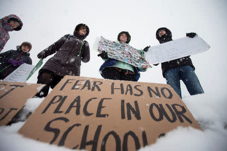 FILE PHOTO: A small group of anti-gun protesters hold a vigil outside the Vermont State Legislature in Montpelier, Vermont, U.S., March 13, 2018. REUTERS/Christinne Muschi/File Photo