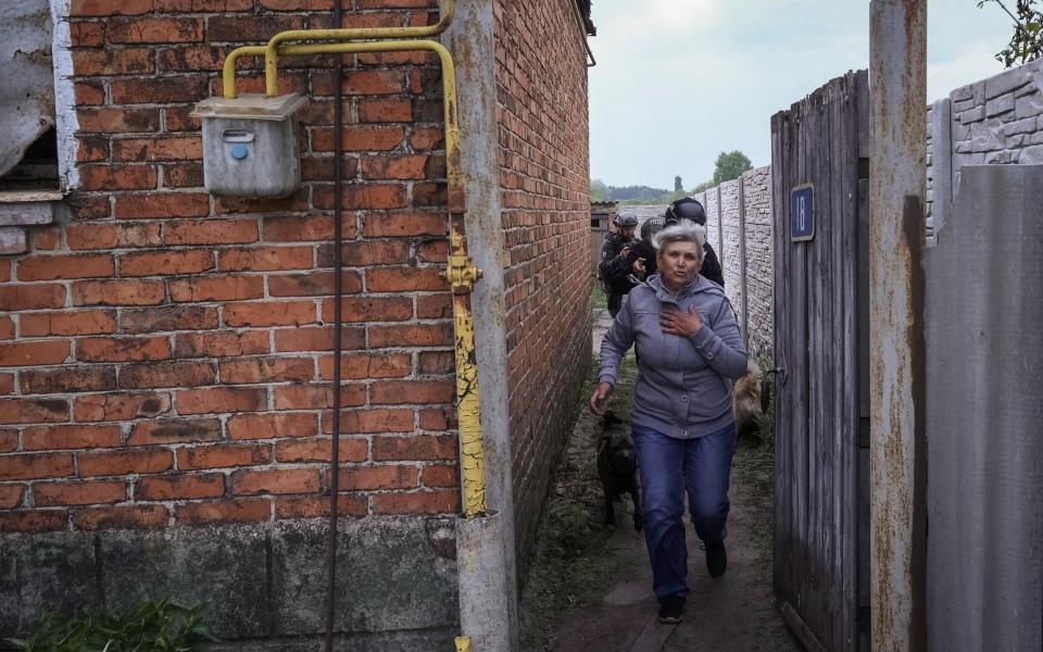 A local resident evacuates to Kharkiv due to Russian shelling, amid Russia's attack on Ukraine, in the town of Vovchansk in Kharkiv region