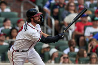Atlanta Braves' Dansby Swanson watches his three-run RBI during the second inning of a baseball game against the St. Louis Cardinals, Monday, July 4, 2022, in Atlanta. (AP Photo/Butch Dill)