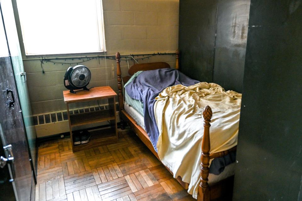 Firefighters beds are partitioned off with lockers in a shared space with the weight room at the Lansing Fire Station 9 on Friday, Oct. 21, 2022, in Lansing.