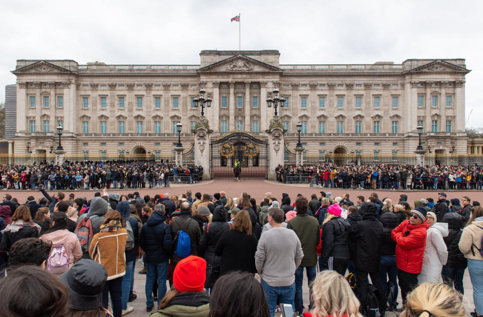 General view of crowds outside Buckingham Palace, London, ahead of the Changing of the Guard ceremony as the Government's top scientist warned that up to 10,000 people in the UK are already infected with Covid-19. (Photo by Dominic Lipinski/PA Images via Getty Images)