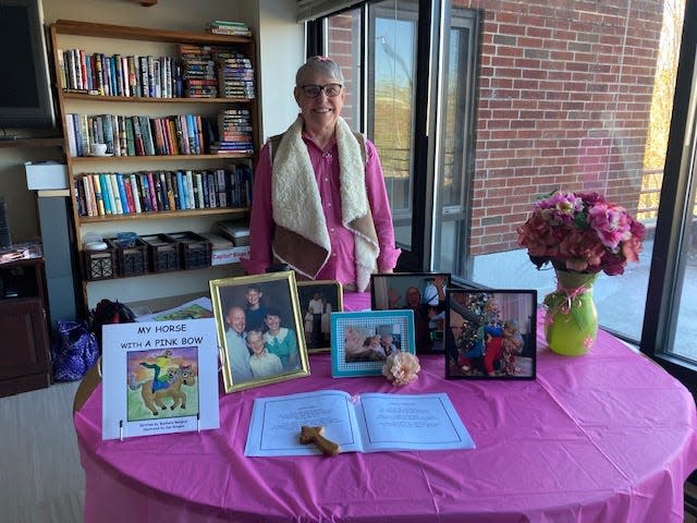 Dover resident Barbara Burgess holds a book signing at Cocheco Park Apartments in Dover.