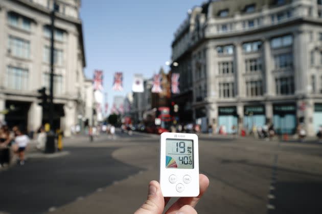 A digital thermometer displays a temperature of 40 degrees Celsius (approximately 104 degrees Fahrenheit) in Oxford Circus, central London. (Photo: Aaron Chown - PA Images via Getty Images)