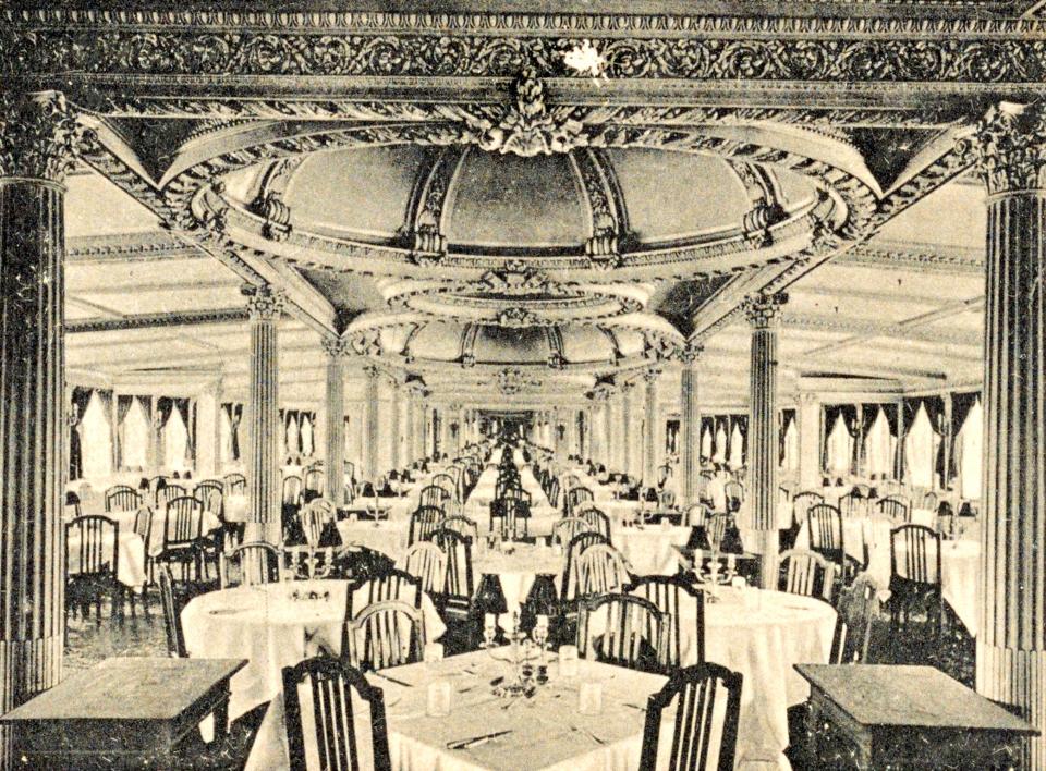 The dining saloon aboard the Fall River Line passenger steamship Commonwealth featured white linen tablecloths and silver utensils.
