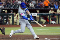 Chicago Cubs' Nico Hoerner connects for a run-scoring double against the Arizona Diamondbacks during the fifth inning of a baseball game Tuesday, April 16, 2024, in Phoenix. (AP Photo/Ross D. Franklin)