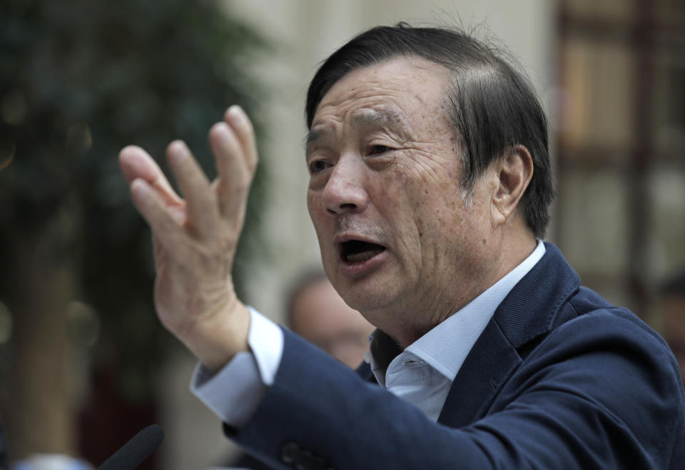 In this Tuesday, Jan. 15, 2019, file photo, Ren Zhengfei, founder and CEO of Huawei, gestures during a round table meeting with the media in Shenzhen city, south China's Guangdong province. The founder of network gear and smart phone supplier Huawei Technologies said the tech giant would reject requests from the Chinese government to disclose confidential information about its customers. (AP Photo/Vincent Yu, File)
