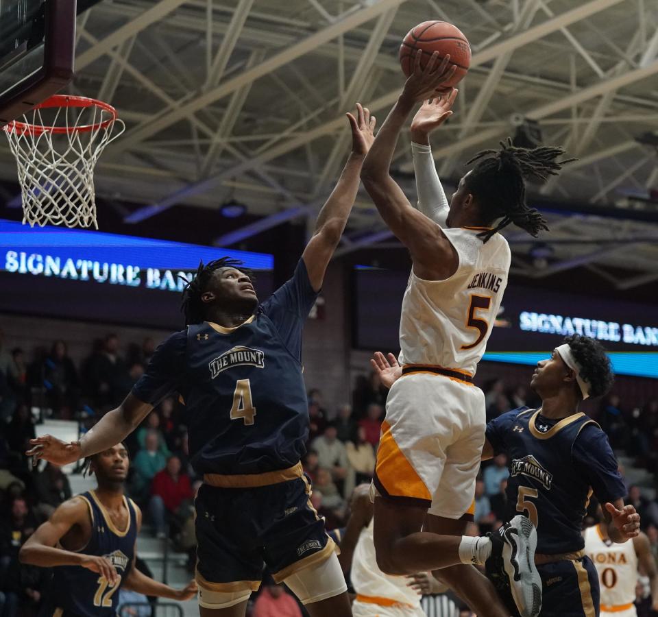 Iona University's Daniss Jenkins (5) puts up a shot over Mt. St. Mary's Dola Adebayo (4) as Iona hosts Mount St. Mary in men's basketball at Iona University in New Rochelle on Friday, February 3, 2023. 