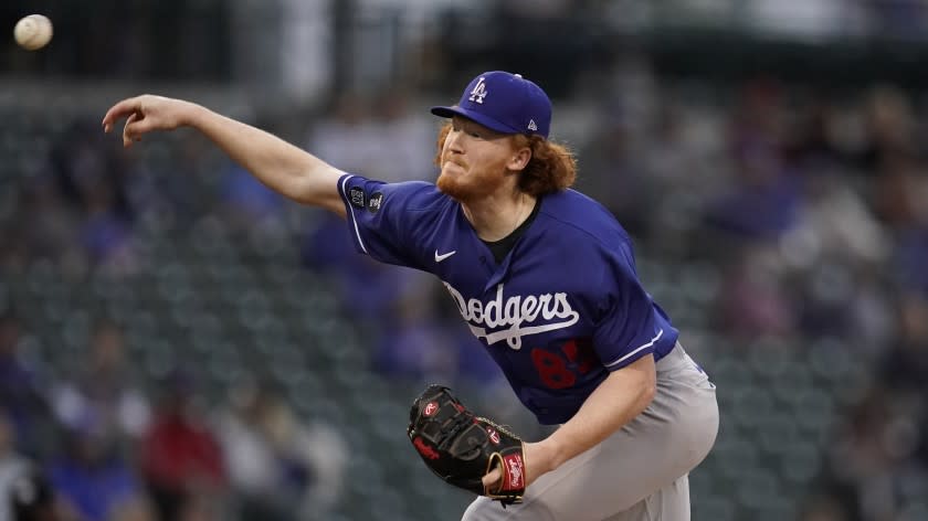 Los Angeles Dodgers starting pitcher Dustin May (85) throws during a spring training baseball game against the Chicago Cubs Thursday, March 25, 2021, in Mesa, Ariz. (AP Photo/Ashley Landis)