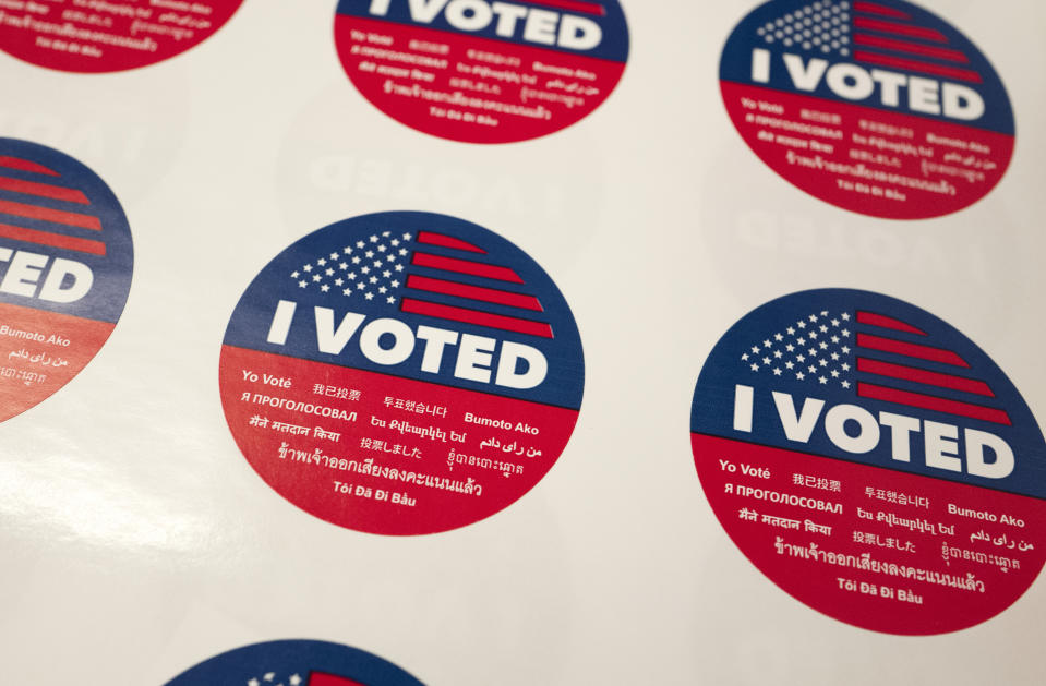 FILE - In this Tuesday, June 5, 2018, file photo, "I Voted" stickers wait for voters at a polling station inside the library at Robert F. Kennedy Elementary School in Los Angeles. Californians start voting Monday, Feb. 3, 2020, in a high-profile Democratic presidential primary that has no clear front-runner. The March 3 primary was moved up from its usual June date so Californians might have more of a say in the outcome of the primary and the decision about the eventual Democratic nominee. (AP Photo/Richard Vogel, File)