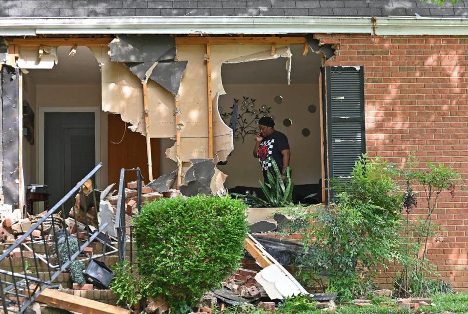 A woman claiming to be the sister of the woman who owns  the home at 5525 Galway Drive stands in a front room on Tuesday, April 30, 2024. The home is the site where three members of the U.S. Marshals task force were killed on Monday, April 29, 204 when they were serving a warrant in the Shannon Park area of east Charlotte. CMPD Officer Joshua Eyer died from wounds suffered at the scene Monday evening. Four other officers were wounded during the shooting.
