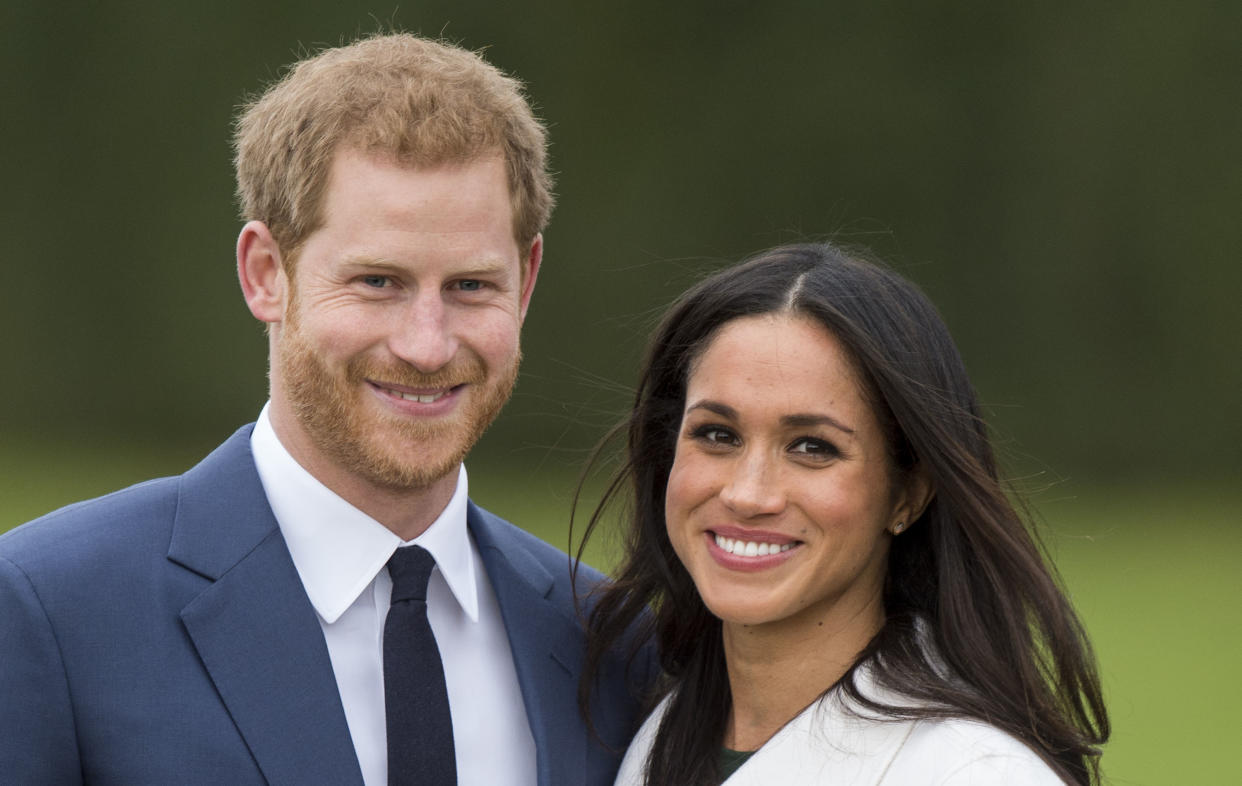 LONDON, ENGLAND - NOVEMBER 27:  Meghan Markle and Prince Harry during an official photocall to announce the engagement of Prince Harry and actress Meghan Markle at The Sunken Gardens at Kensington Palace on November 27, 2017 in London, England.  Prince Harry and Meghan Markle have been a couple officially since November 2016 and are due to marry in Spring 2018.  (Photo by Mark Cuthbert/UK Press via Getty Images)