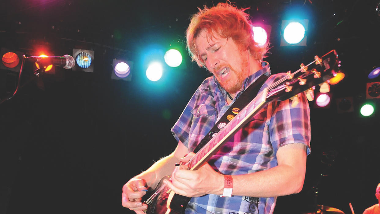  Guitarist Lyle Workman performs on stage. 