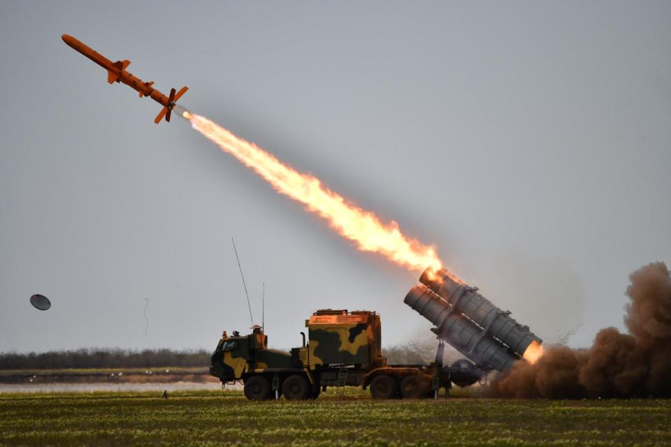A road-mobile launcher firing a Neptune missile in testing.