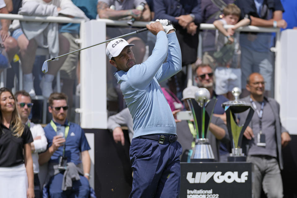 Charl Schwartzel of South Africa plays a tee shot during the final round of the inaugural LIV Golf Invitational at the Centurion Club in St. Albans, England, Saturday, June 11, 2022. (AP Photo/Alastair Grant)