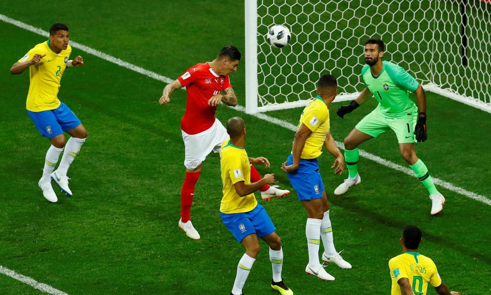 Steven Zuber rises to head in Switzerland’s controversial equaliser after Philippe Coutinho had put Brazil ahead with a wonderful curling strike.