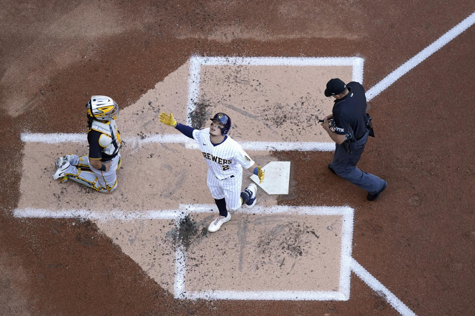 Milwaukee Brewers' Luis Urias looks skyward as he crosses home plate after hitting a home run in the second inning of a baseball game against the Pittsburgh Pirates, Saturday, July 9, 2022, in Milwaukee. (AP Photo/Morry Gash)