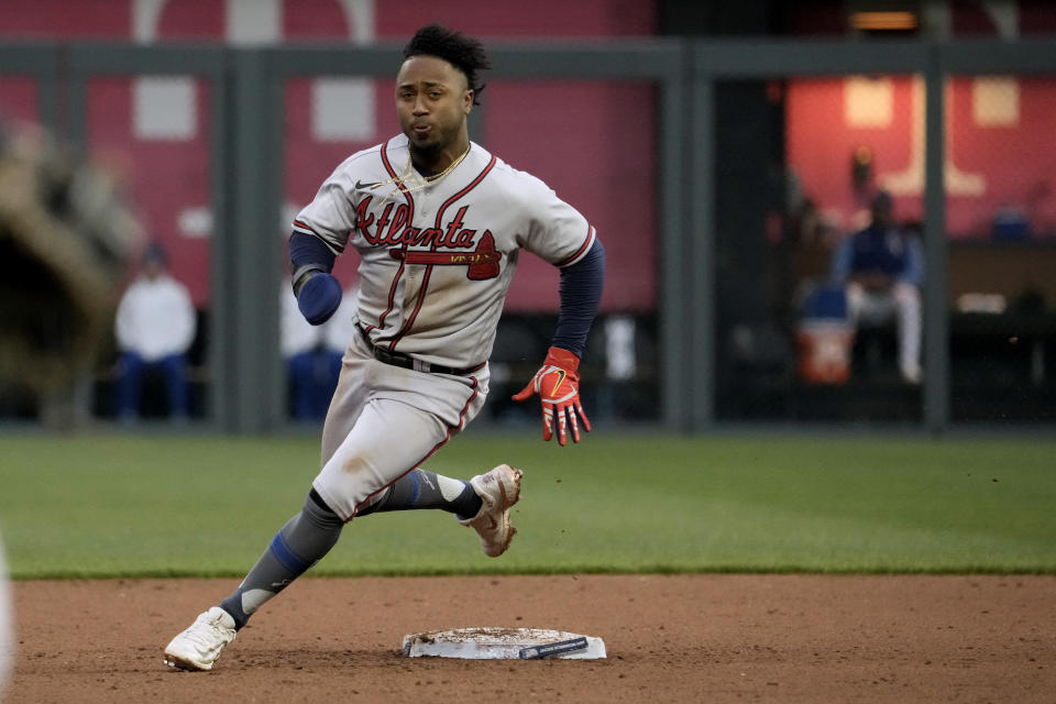 Atlanta Braves' Ozzie Albies runs to third on a single hit by Vaughn Grissom during the fifth inning of a baseball game against the Kansas City Royals Saturday, April 15, 2023, in Kansas City, Mo. (AP Photo/Charlie Riedel)