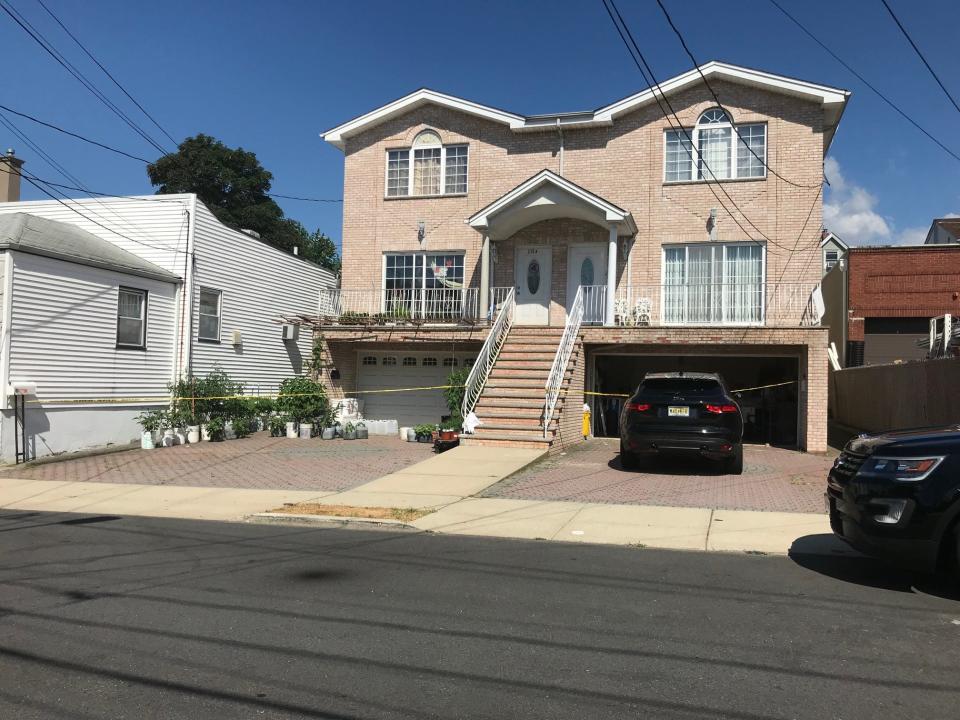 Police tape can be seen surrounding a house in Fairview on Sunday, June 30, 2019.