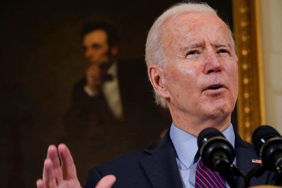 With a portrait of former President Abraham Lincoln behind him, President Joe Biden speaks about the economy in the State Dinning Room of the White House, Friday, Feb. 5, 2021, in Washington.