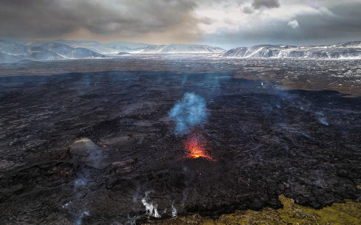  An aerial view of the volcano on the Reykjanes peninsula in south west Iceland which has erupted after weeks of intense earthquake activity, on December 20, 2023 in Grindavik, Iceland. 