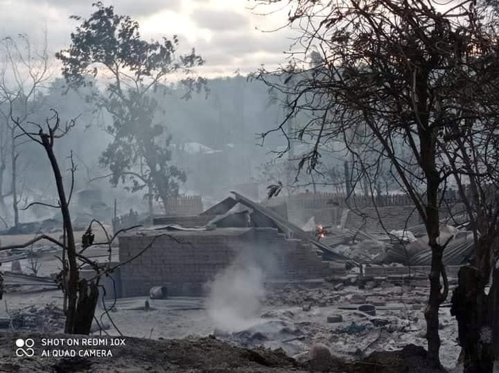 A view shows burnt houses in Kin Ma Village