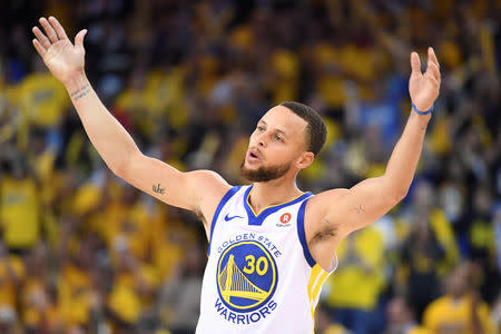 FILE PHOTO: May 8, 2018; Oakland, CA, USA; Golden State Warriors guard Stephen Curry (30) celebrates during the third quarter in game five of the second round of the 2018 NBA Playoffs against the New Orleans Pelicans at Oracle Arena. The Warriors defeated the Pelicans 113-104. Mandatory Credit: Kyle Terada-USA TODAY Sports/File Photo