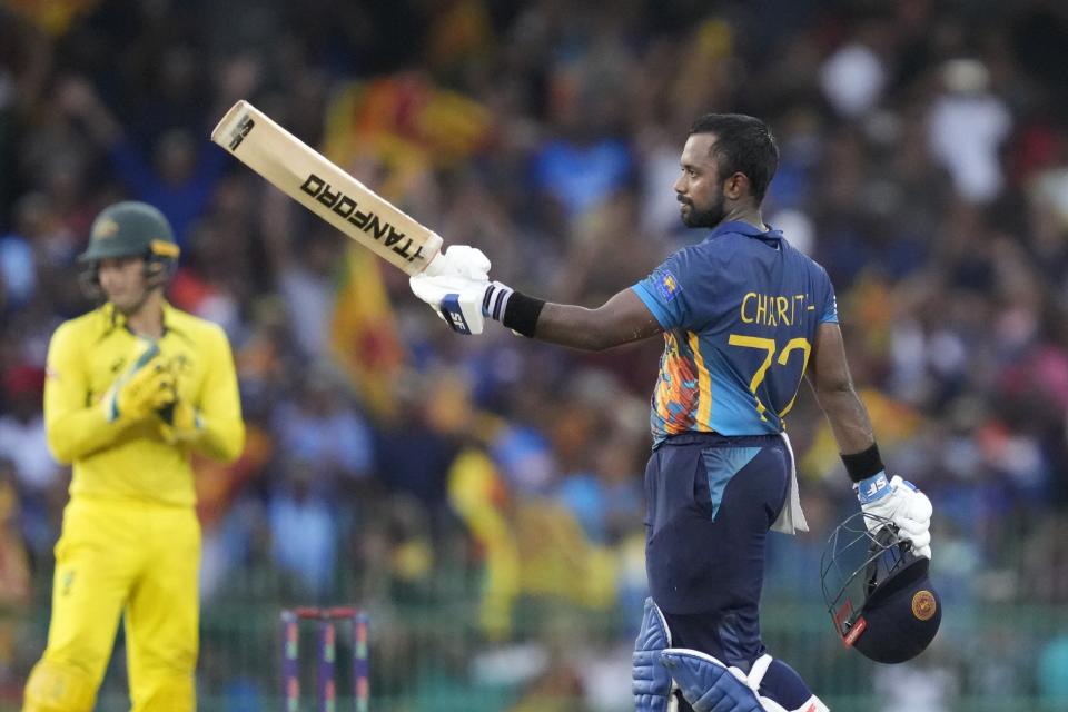 Sri Lanka's Charith Asalanka celebrates scoring hundred runs during the fourth one-day international cricket match between Australia and Sri Lanka in Colombo, Sri Lanka, Tuesday, June 21, 2022. (AP Photo/Eranga Jayawardena)