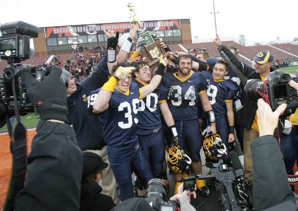 The Kirtland Hornets celebrate a state title in 2011 at Paul Brown Tiger Stadium in Massillon.