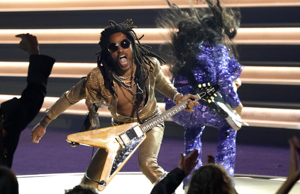 Lenny Kravitz, left, and H.E.R. perform "Are you Gonna Go My Way" at the 64th Annual Grammy Awards on Sunday, April 3, 2022, in Las Vegas. (AP Photo/Chris Pizzello)