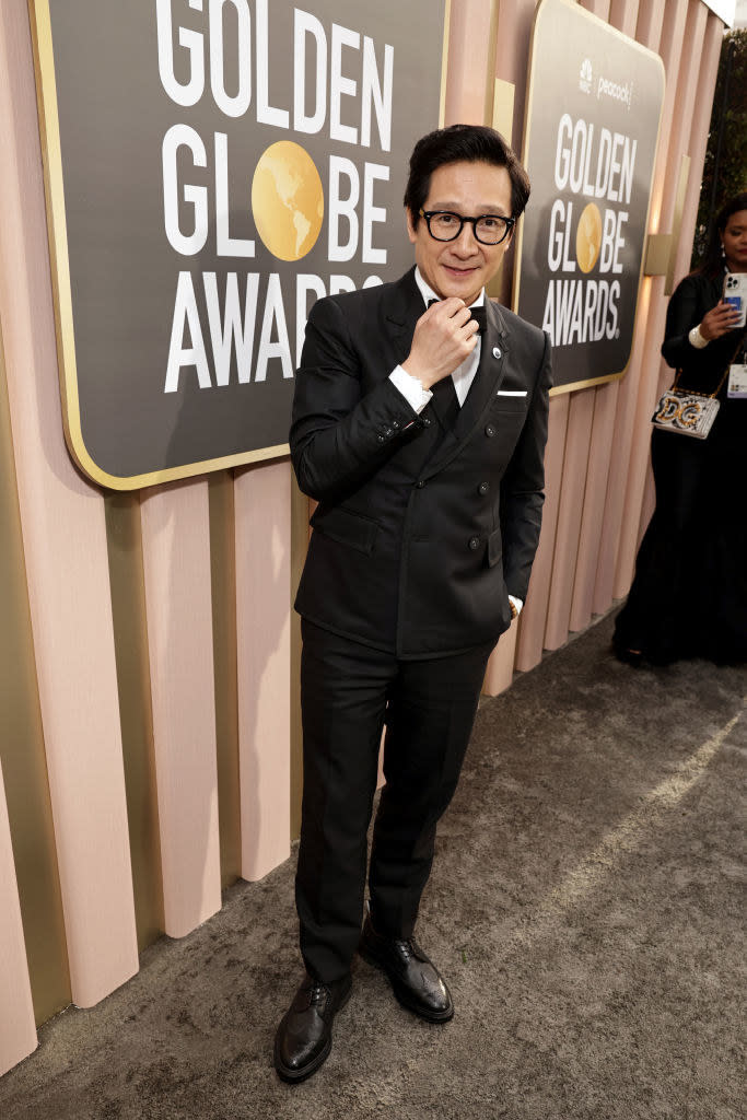 Ke Huy Quan arrives at the 80th Annual Golden Globe Awards in a suit