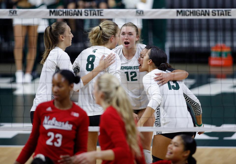 Michigan State players celebrate a play against Nebraska, Thursday, Oct. 6, 2022, in East Lansing, Mich.