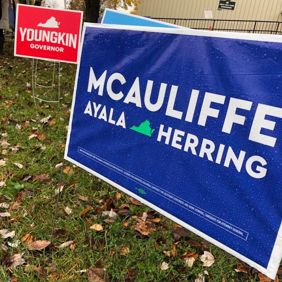 Election signs are posted for Virginia's hotly-contested race for governor, outside the Gypsy Hill Park gym polling place in Staunton, Virginia.