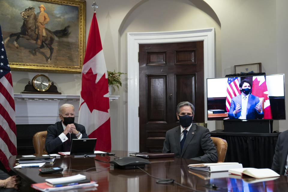 President Joe Biden and Secretary of State Antony Blinken listen as Canadian Prime Minister Justin Trudeau speaks during a virtual bilateral meeting, in the Roosevelt Room of the White House, Tuesday, Feb. 23, 2021, in Washington. (AP Photo/Evan Vucci)