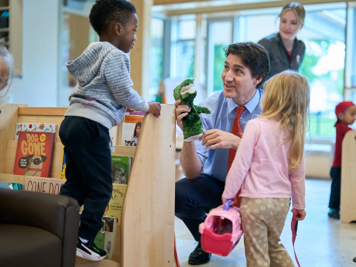 Prime Minister Justin Trudeau speaks with kids at the Stationview YMCA Childcare Centre in St. Thomas, Ont., Monday, May 13, 2024. (Geoff Robins/Canadian Press - image credit)